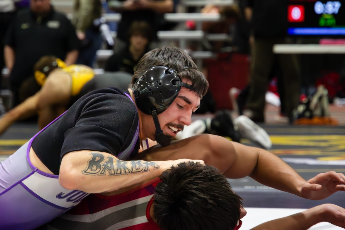 Sophomore Isaac Barba fighting to win a point at North Central Invitational on December 13, 2025.