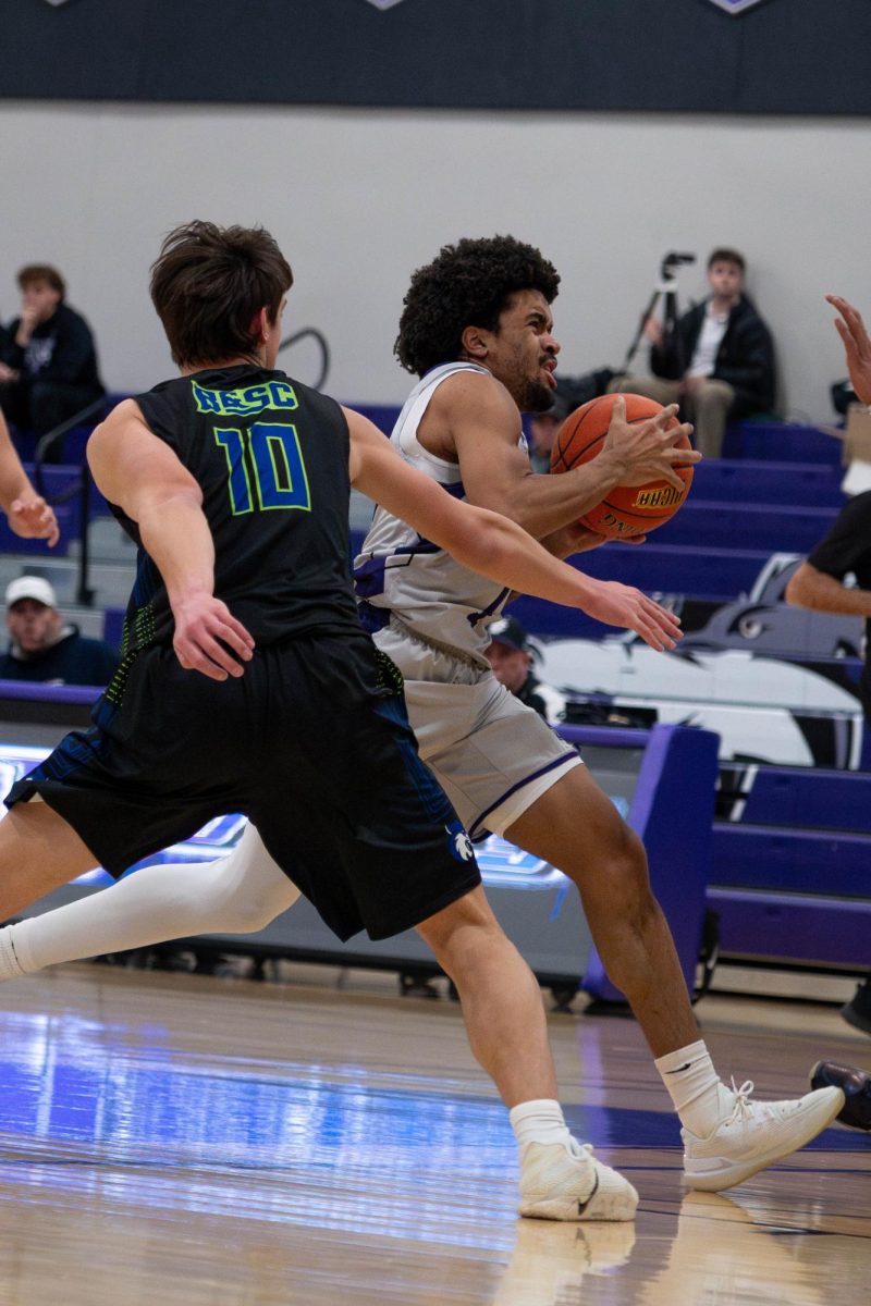 Ricky Hill drives to the basket. The Wolves won in double-overtime on March 1 at the NCJJA Division III District Championship to qualify for the national tournament. 