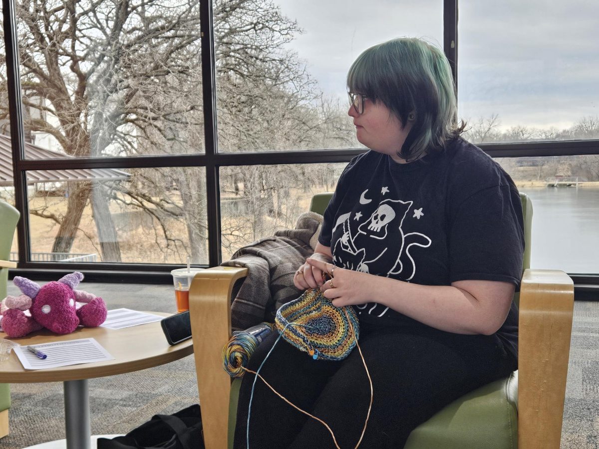 Bucket hats are much needed for protection from the sun during festivals. Mars Pierce, student at Joliet Junior College, is creating a few of them to be gifted to a cousin's friends.