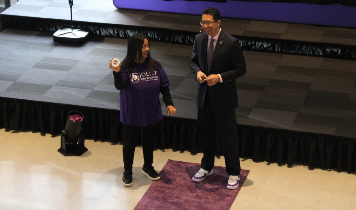 Right before the reveal of the logo, Dr. Clyne  Namuo, President of Joliet Junior College, showed off some vintage JJC merchandise, that participants for the reveal were wearing or brought with them. 