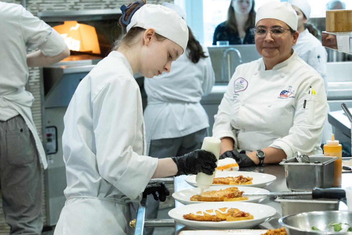 JJC culinary student cooks prepares a dish at the student run restaurant Thrive on April 22, 2026.