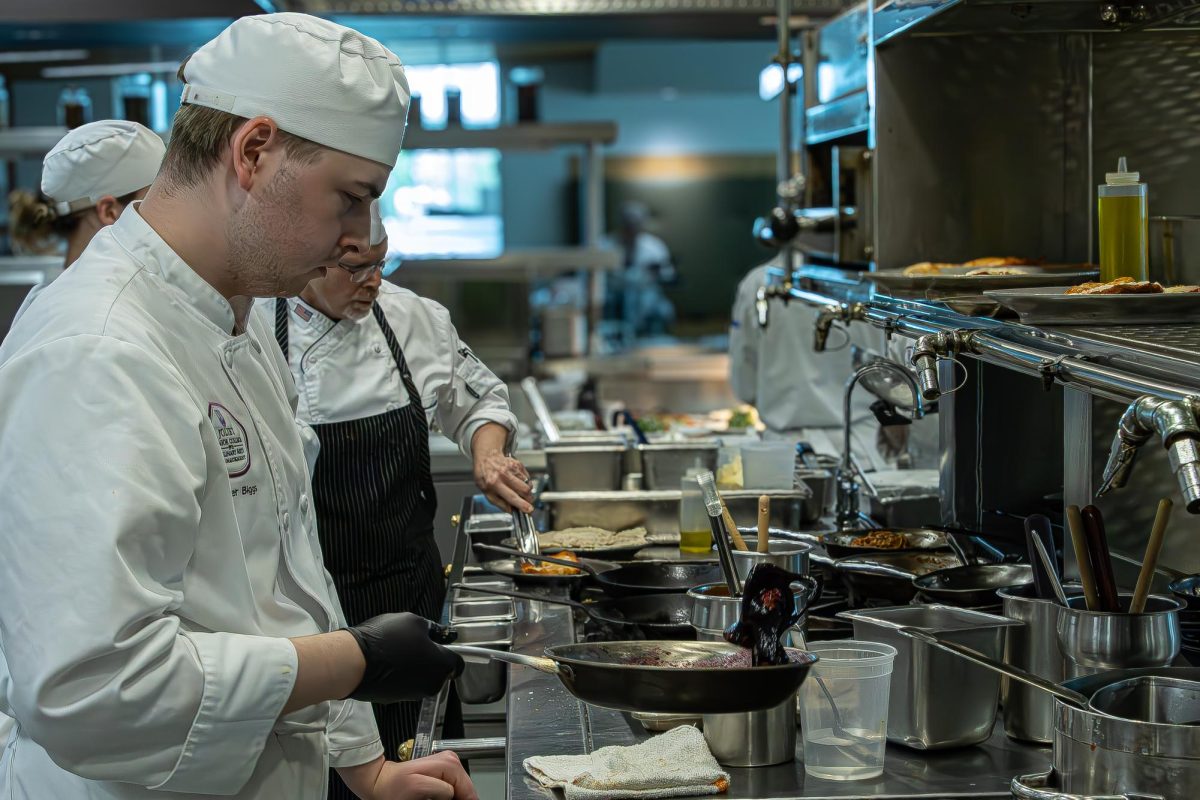 JJC culinary student cooks prepares a dish at the student run restaurant Thrive on April 22, 2026.