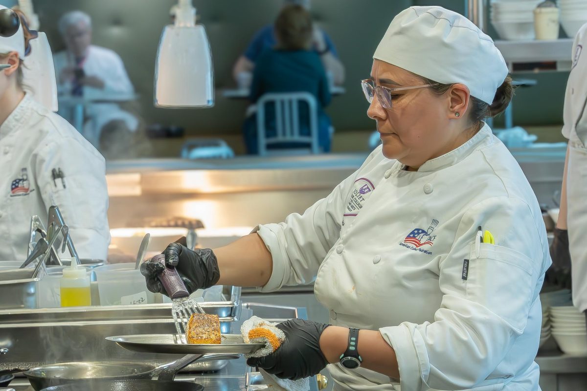 JJC culinary student cooks prepares a dish at the student run restaurant Thrive on April 22, 2026.