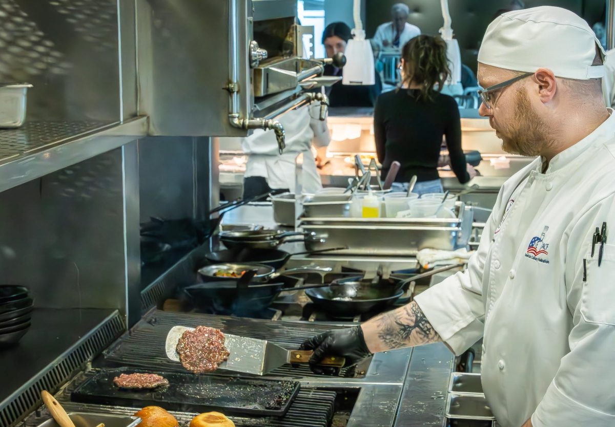 JJC culinary student cooks up a burger at the student run restaurant Thrive on April 22, 2026.