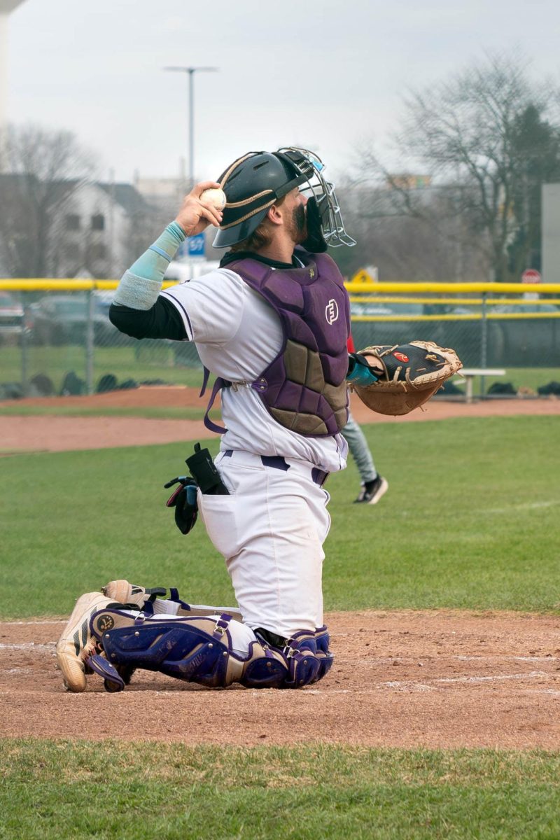Sophomore Max Miller getting ready to throw the ball during a Baseball match against Kankakee Community College on Tuesday, March 24, 2026. The Wolves won 4-3.