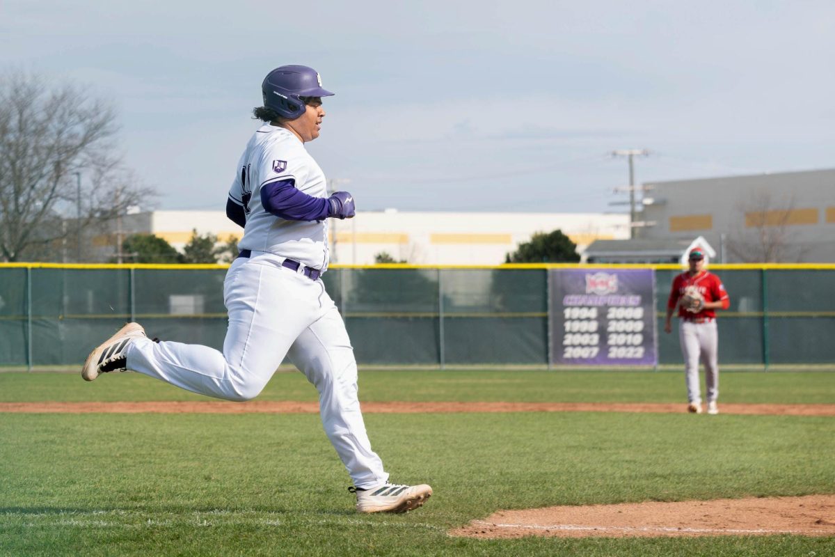 Sophomore Isaiah Rhodes running to reach the base on Tuesday, March 24, 2026 during a Baseball game against Kankakee Community College. The Wolves won 4-3.
