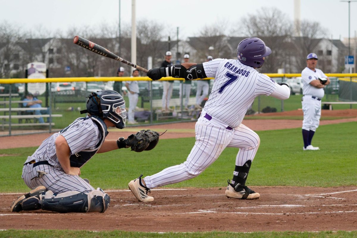 Sophomore Jose Granados beginning to run after hitting the ball on Thursday, April 9, 2026 during a Baseball game against vs South Suburban College. The Wolves won 8-2.