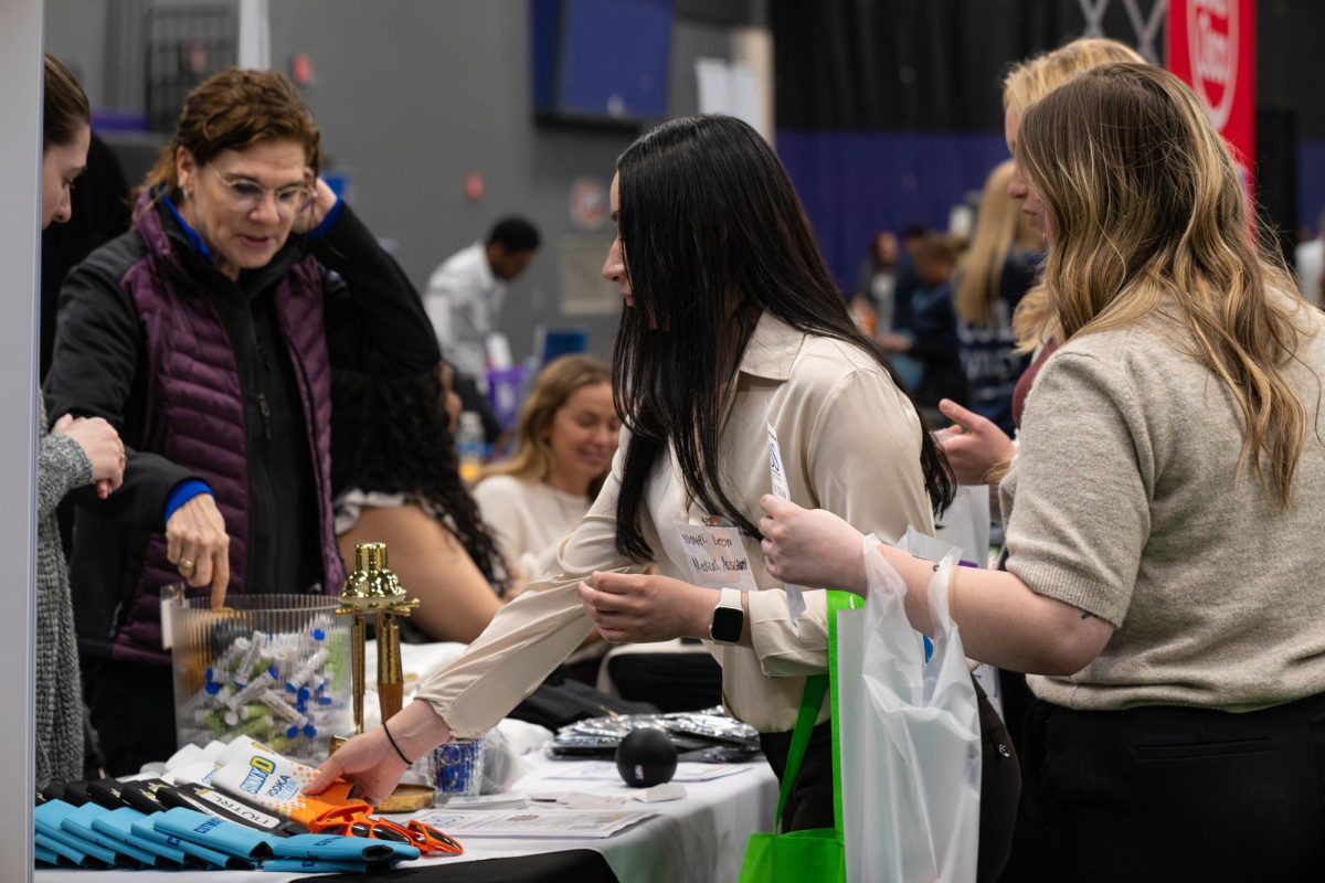 Medical Assistant Nayeli Leon at the Adult Beverage Solutions company table at the Joliet Regional Career & College Fair on March 26, 2026. 