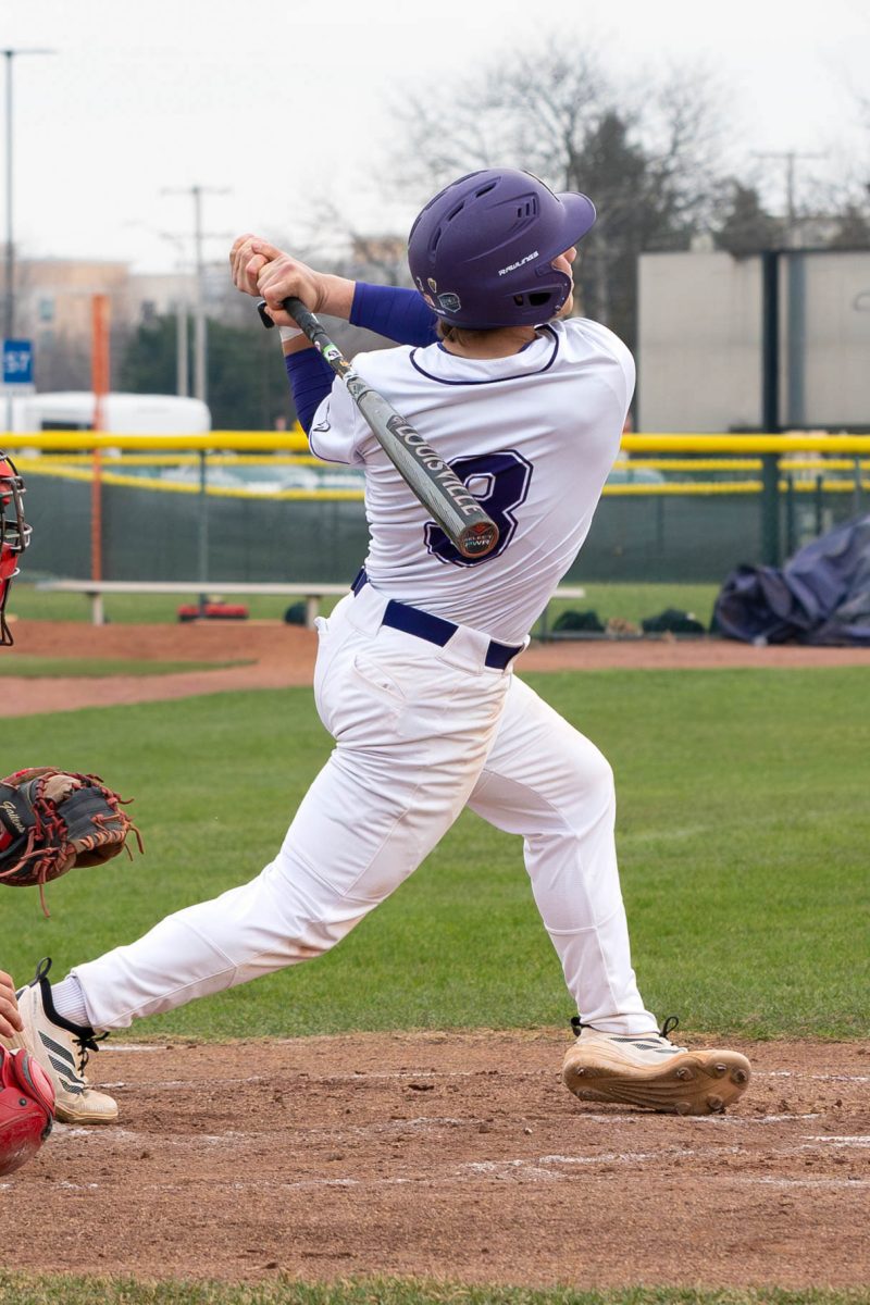 Freshman John O'Brien after swinging to hit the ball on Tuesday, March 24, 2026 during a Baseball game against Kankakee Community College. The Wolves won 4-3.