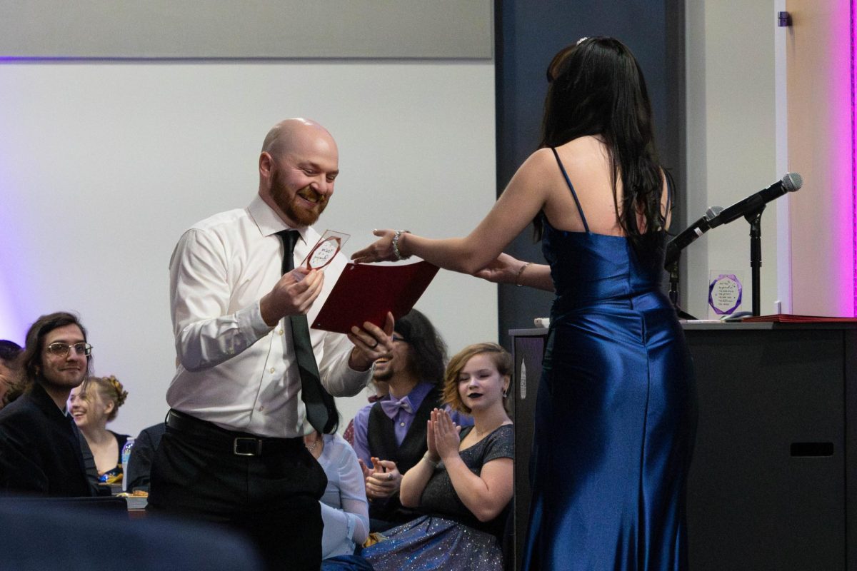 Student Ally Loucks handing student activities coordinator, Steven Karasewski his award at the Met Gala event that took place on Friday, April 17, 2026, from 6:30-9:00 p.m. 
