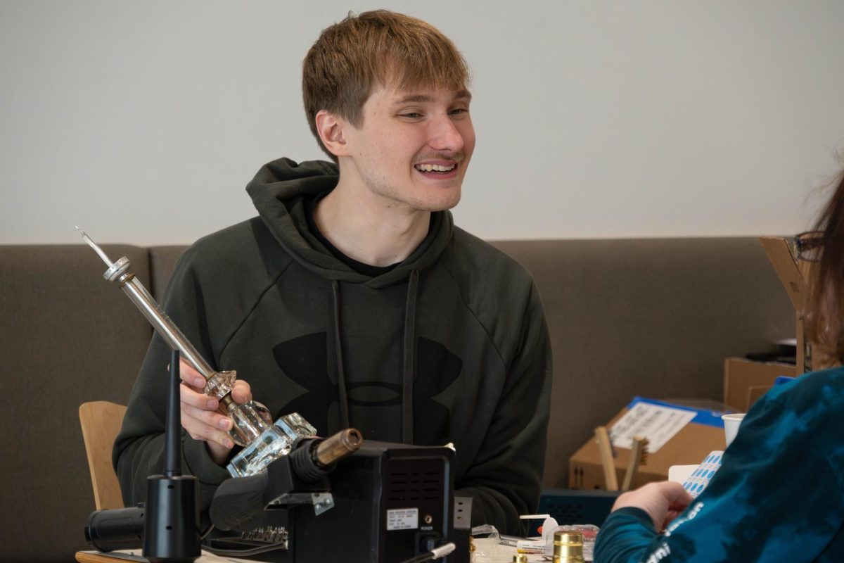 Nick Alexander fixing items at the electronics station during the Repair Cafe at Romeoville campus on April 18, 2026.