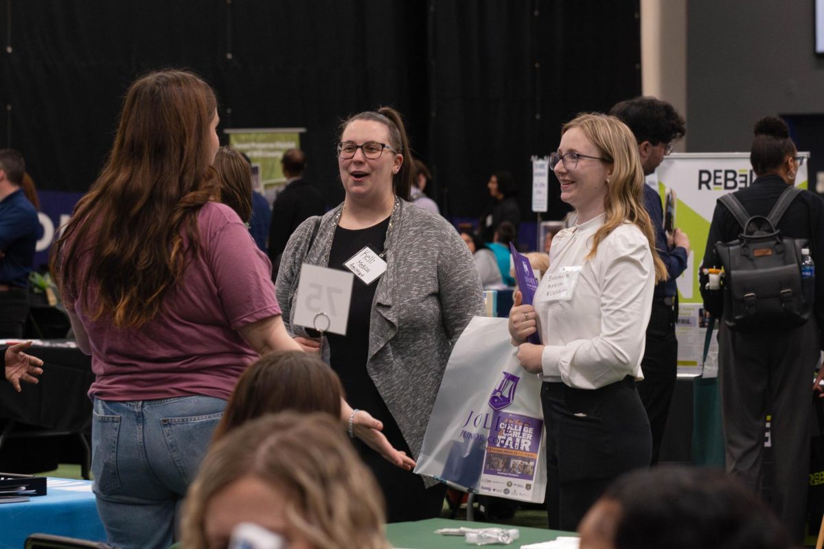 Medical Assistants Kelli and Brooke B. speaking with Olympia Fields Country Club table at the Joliet Regional Career & College Fair on March 26, 2026.