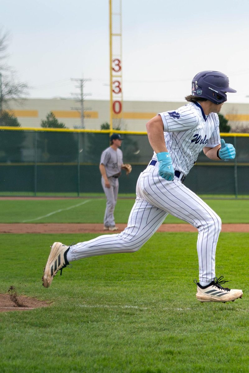 Freshman Brenden Henderson running after hitting the ball on Thursday, April 9, 2026 during a Baseball game against vs South Suburban College. The Wolves won 8-2.