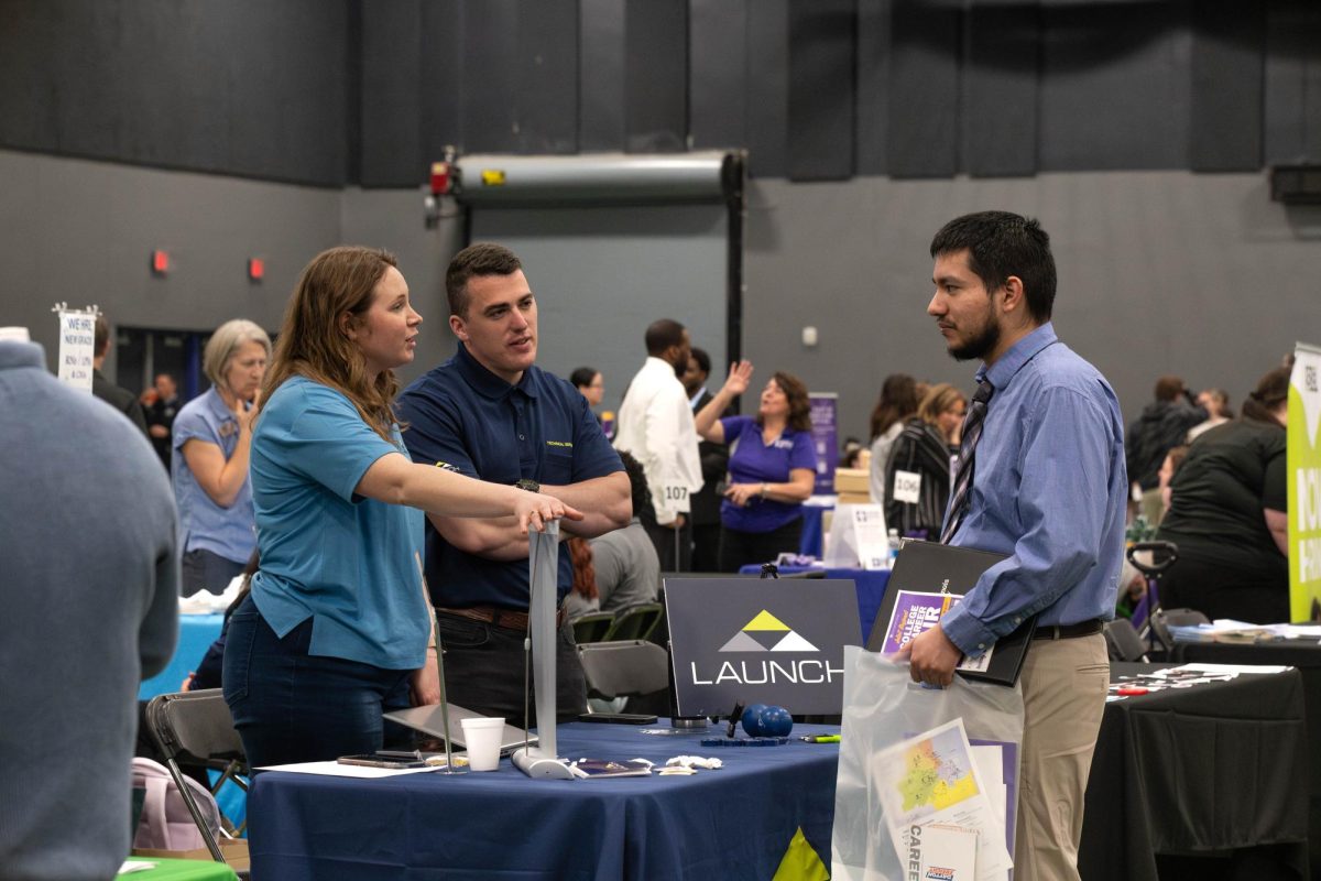 Attendee speaking with the launch table at the Joliet Regional Career & College Fair on March 26, 2026.