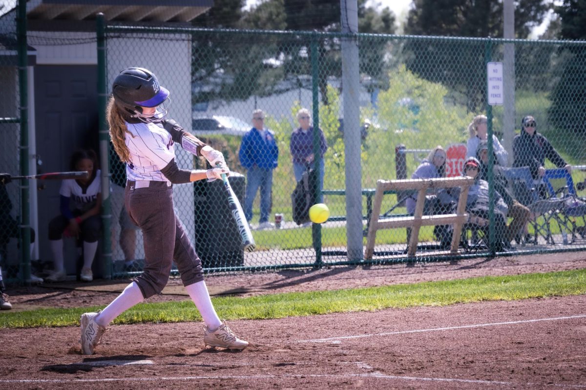 Sophomore Lea Herkel striking the ball on April 28, 2026. Herkel also stole two bases in the wolves victory against Kishwaukee College in 5 innings 10-0 on their sophomore night.